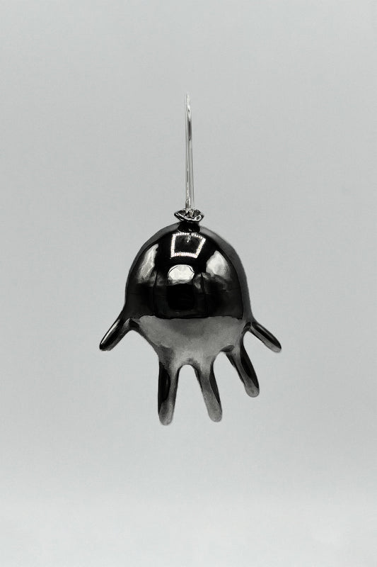 GLOVE BALLOON SINGLE EARRING front view on grey: glossy black rhodium inflated glove with fingers spread, silver hook
