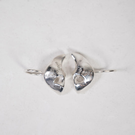 SCUBA EAR PLUGS, mirrored pair on white: backs engraved "EDNA ST LOUIS", each with a thin wire hoop