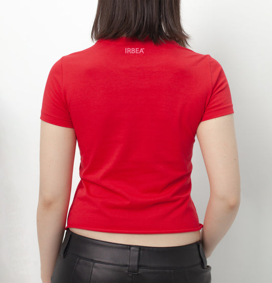 I'D RATHER BE EATING ASS T-SHIRT on a model, back view: plain red with a small pink "IRBEA" print below the collar