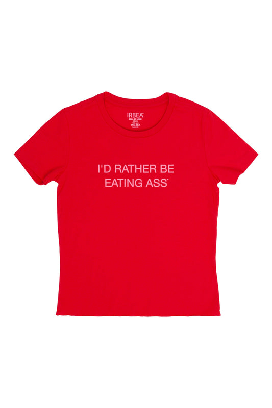 I'D RATHER BE EATING ASS T-SHIRT laid flat, front: red crew-neck tee with pink slogan and raw cut-off hem