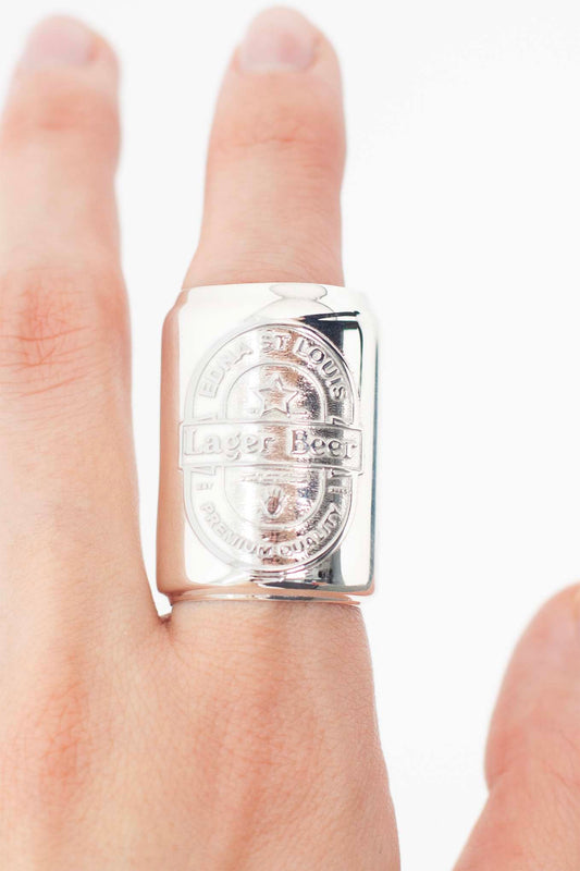 LAGER BEER CAN RING on a finger: sterling silver can-shaped ring with an embossed "EDNA ST LOUIS Lager Beer" oval label