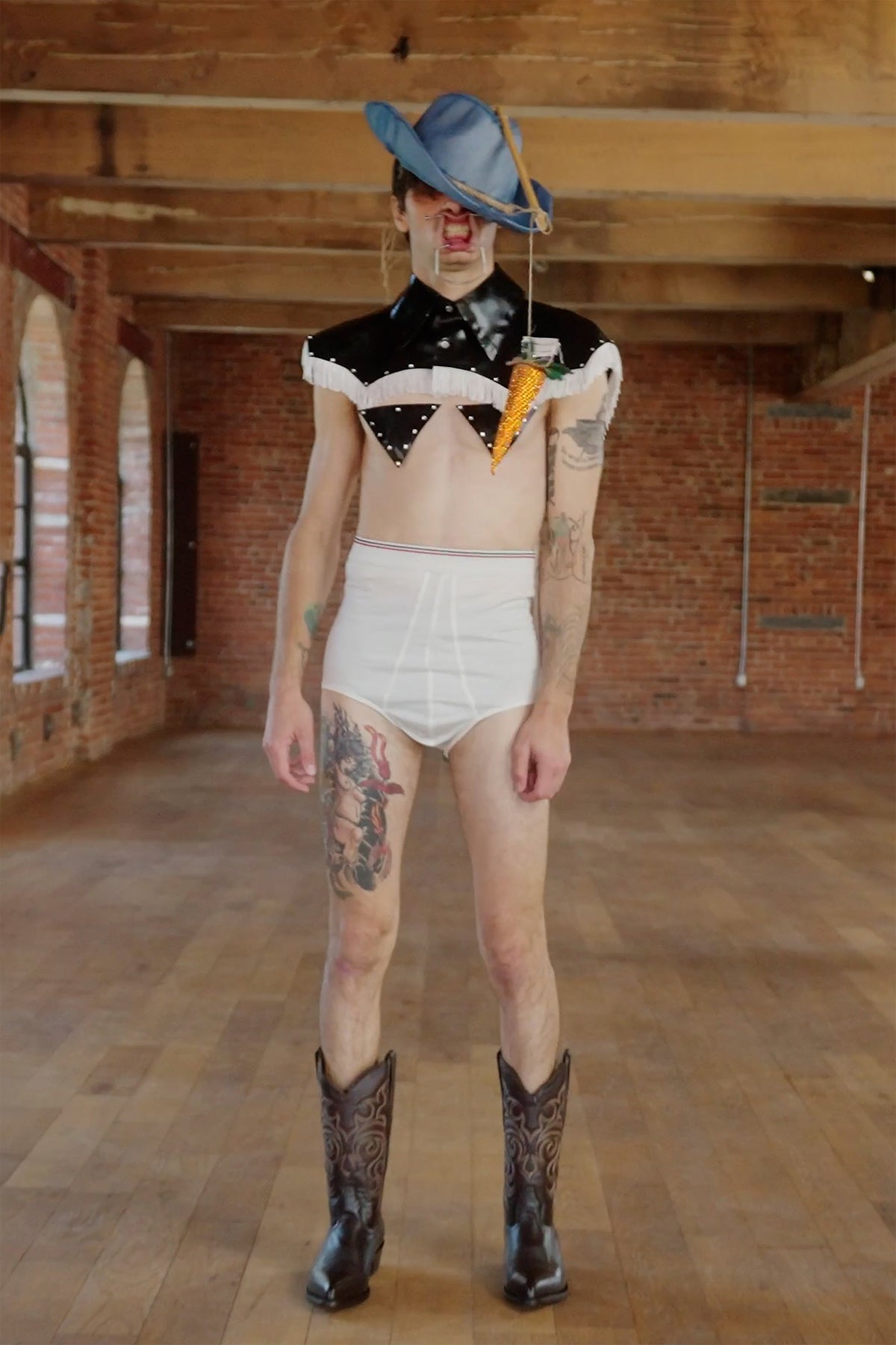LOOK 4, Save A Horse, Ride A Cowboy: full-length front view, crystal carrot hung from the denim hat brim before the face