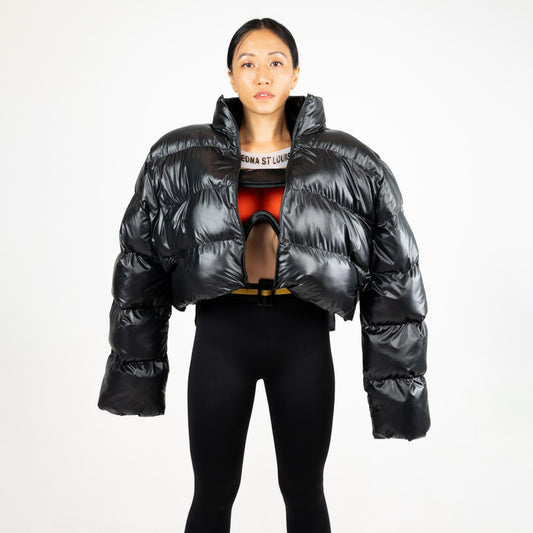 SCUBA PUFFER JACKET, square front crop: open glossy black puffer over a goggle-style bra top and black leggings
