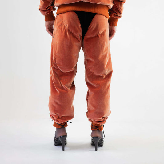 LIFT TRACK PANT, back view on a model: padded "muscle" seat and legs, with the black velour "thong" showing at the top