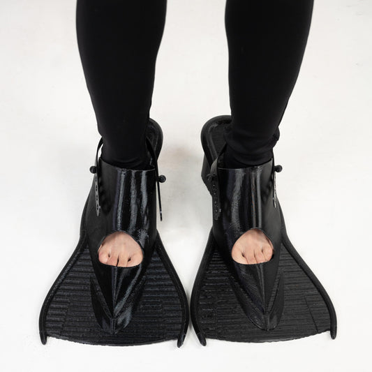 SCUBA HEELS from above on a model: pointed peep toes over wide, ridged black fins