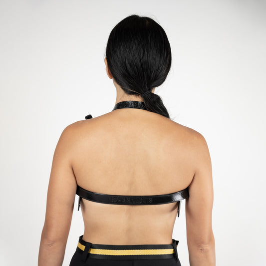SCUBA BRA back view, black halter neck strap and thin band across the back, model with a low ponytail