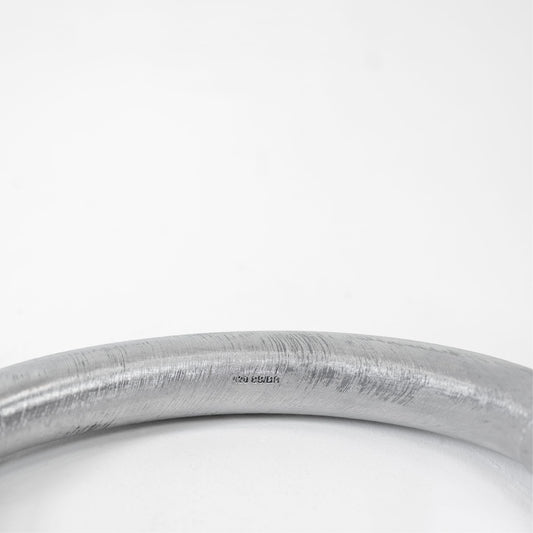 SWIM NECKLACE, macro of the brushed silver tube with a small stamped marking 420 SS/BR