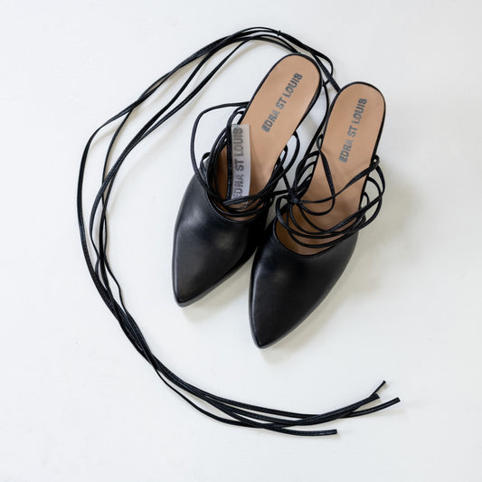 LACE-UP MULES, pair from above: black pointed toes, tan insoles printed "EDNA ST LOUIS", long laces lying loose